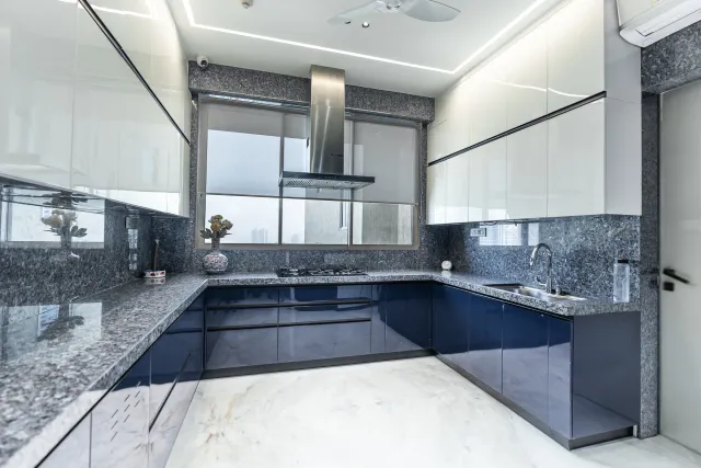 Blue and White C-Shaped Modular Kitchen
